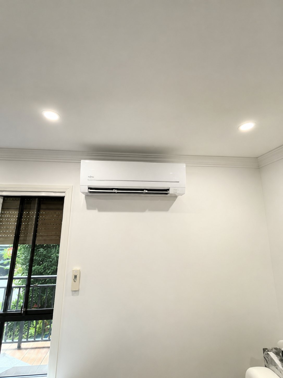 Fujitsu split system installed above a balcony door